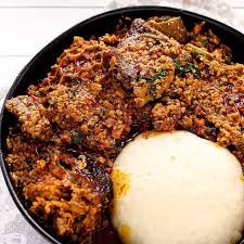 Pounded yam with egusi soup and assorted meats