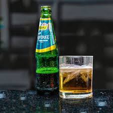 Bottle of Fayrouz drink on table