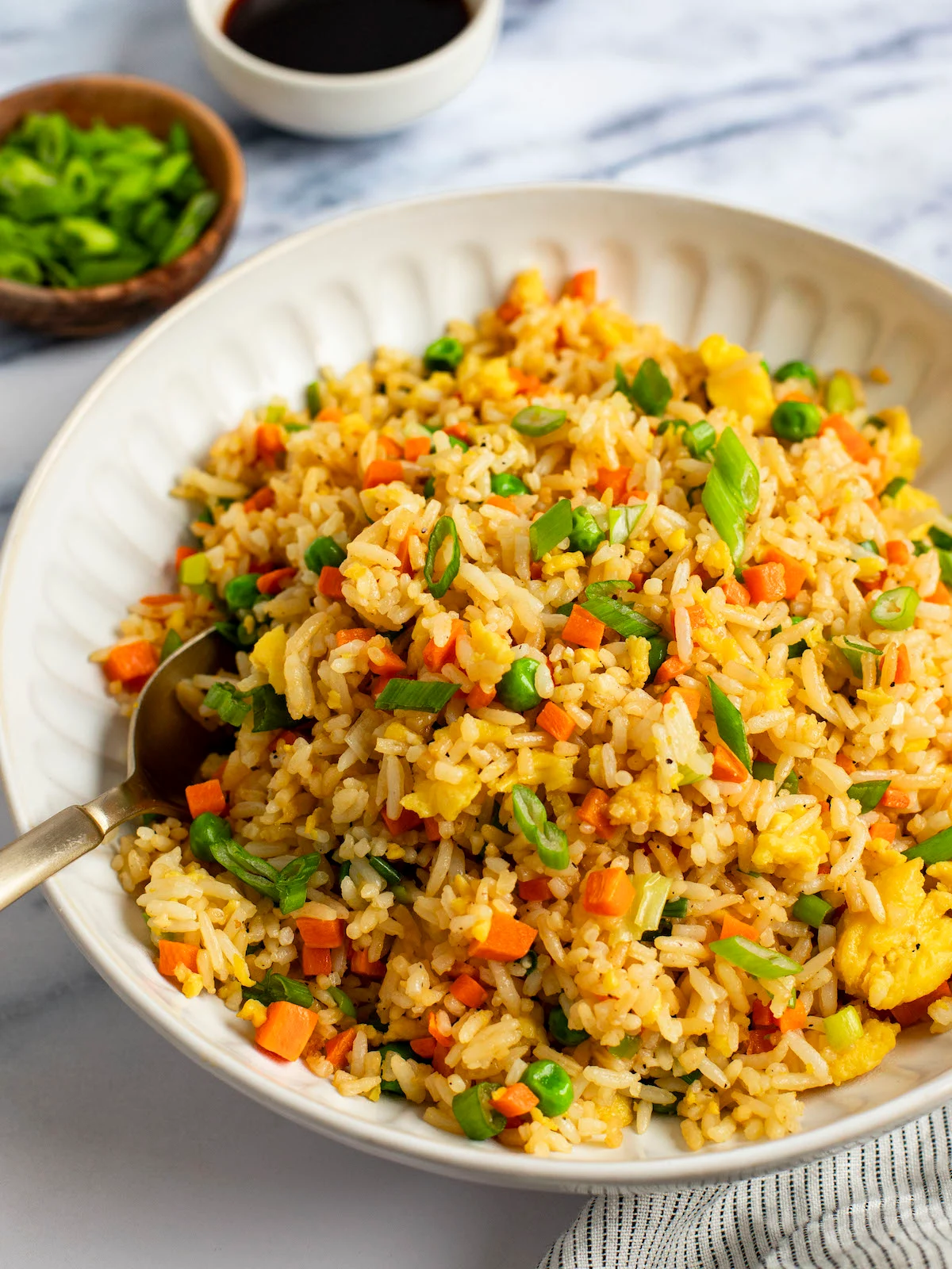 Nigerian Fried Rice with vegetables and grilled chicken
