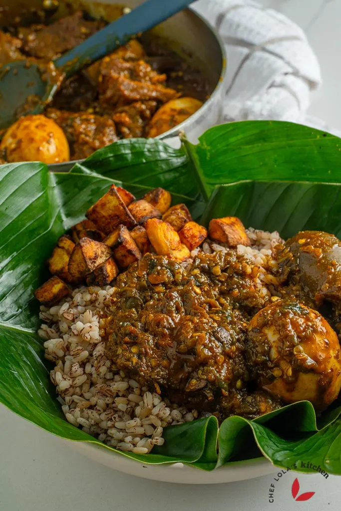 Ofada rice with ayamase sauce and assorted meat